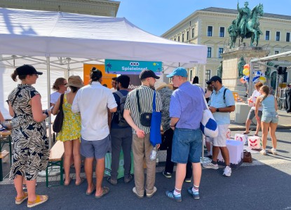 Visitors gathering in front of the MCQST booth at Zamanand Festival.