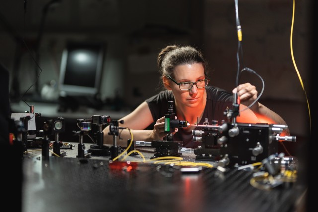 Jasmin Meinecke working on a laser table-top experiment in her laboratory at the Max Planck Institute of Quantum Optics.