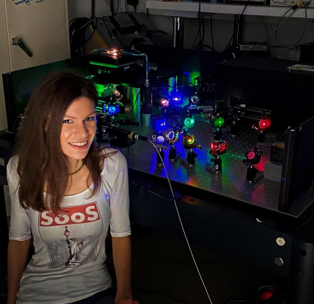 Lina Todenhagen sitting next to her experiments in the laboratory at WSI.