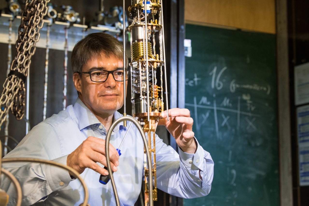 Prof. Christian Pfleider working on a cryostat