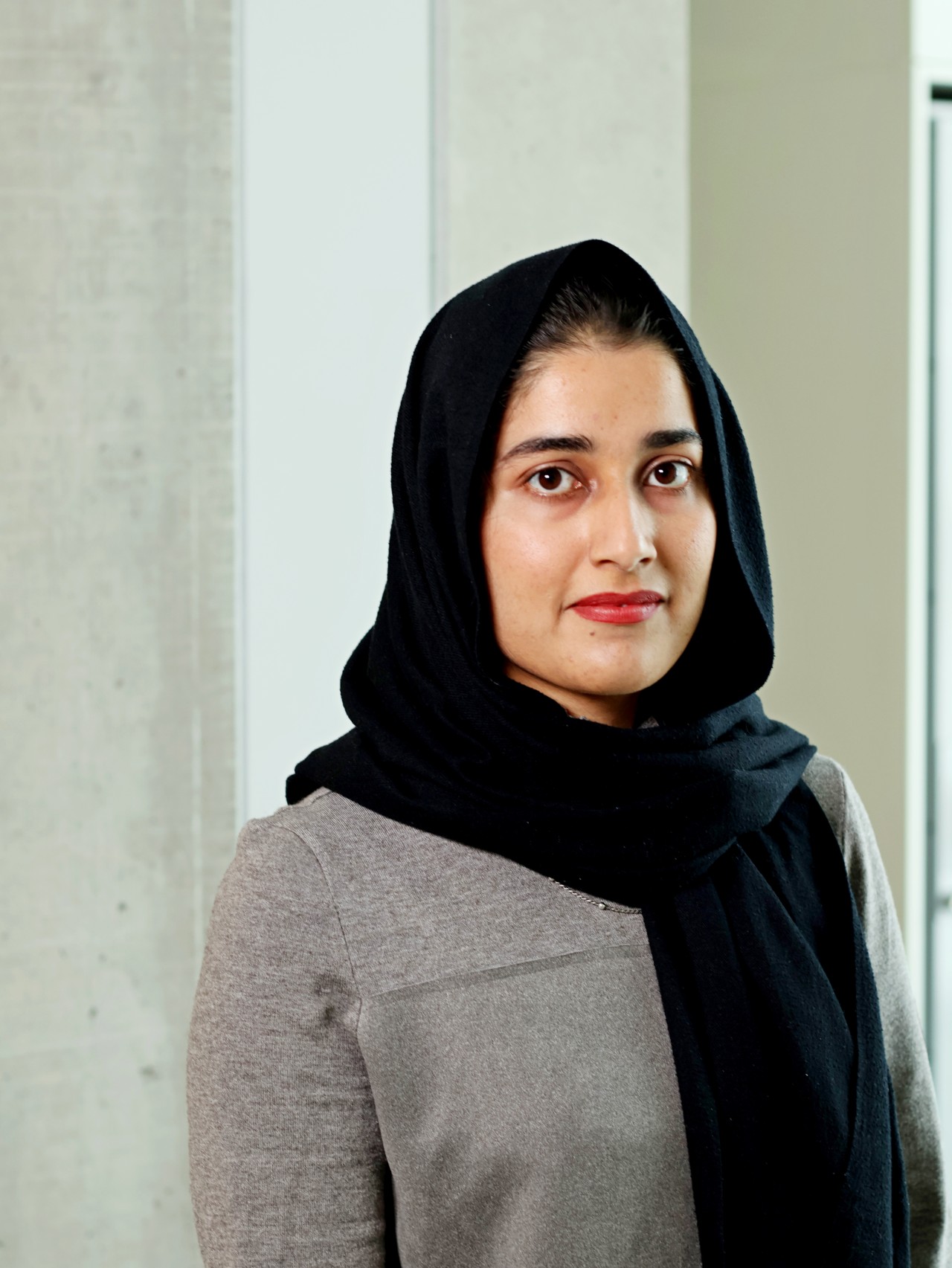 Portrait foto of female researcher wearing a head scarf. 