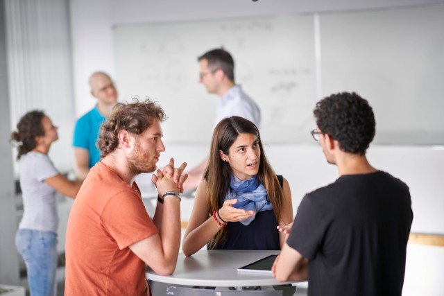 Young group of researchers discussing.