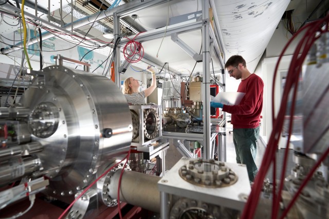 Scientists working in a Quantum Dynamics laboratory.